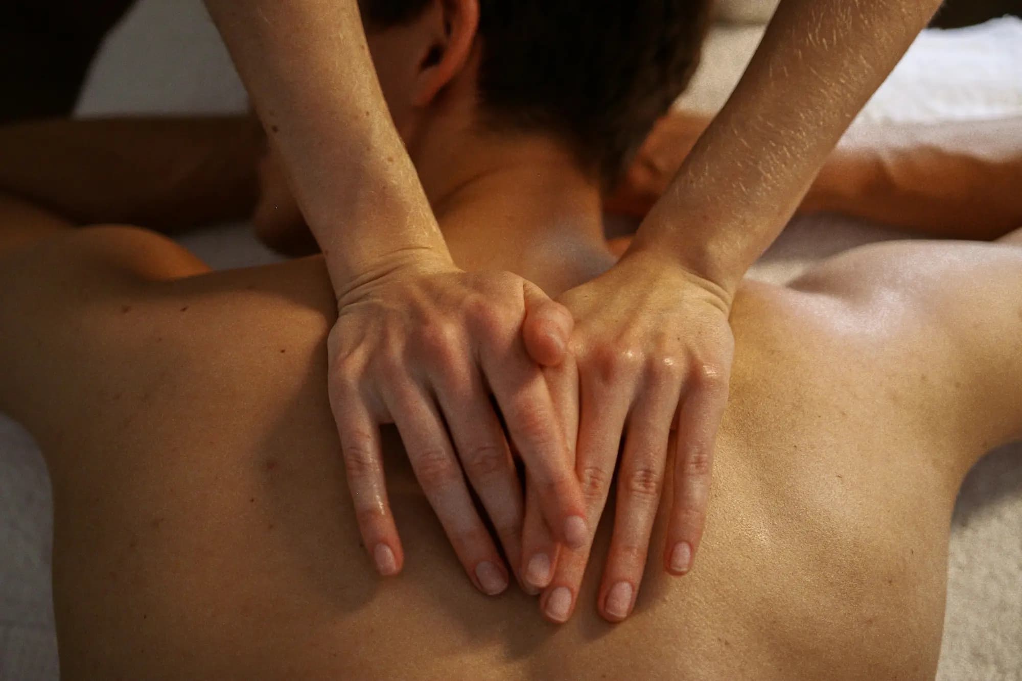 Hands on the back during a massage